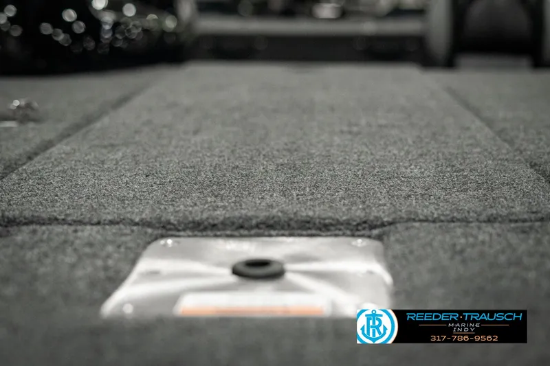 Slide: The Image of 2025 Lund 1875 Pro-V Bass XS boat interior with carpeted flooring. - 38