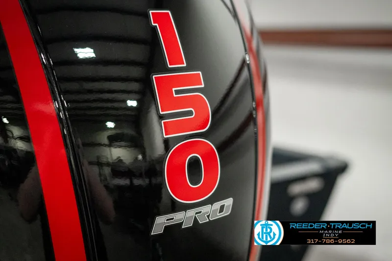 Slide: The Image of Close-up of 2025 Lund 1875 Pro-V Bass XS engine with "150 Pro" branding. - 41