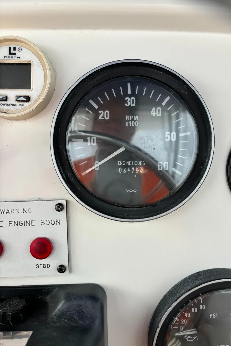 Slide: The Image of Close-up of 1998 Silverton 352 Motor Yacht tachometer and engine warning indicators. - 23
