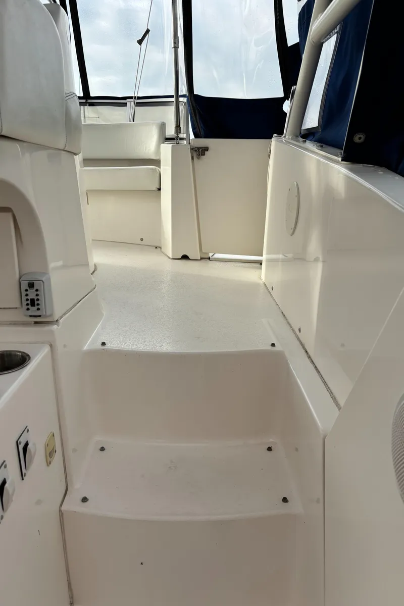 Slide: The Image of Interior view of 1998 Silverton 352 Motor Yacht, featuring steps and seating area. - 25