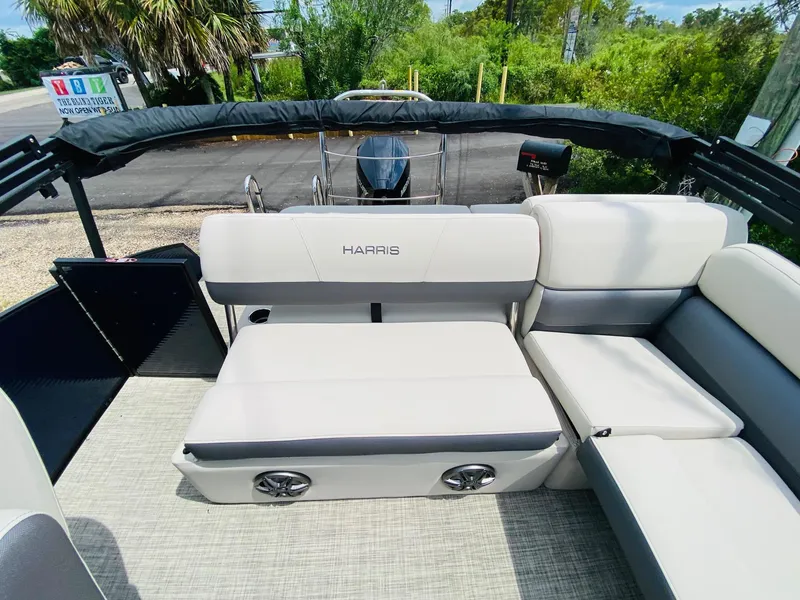 Slide: The Image of 2023 Harris Cruiser 230 boat interior with plush seating and modern design. - 13