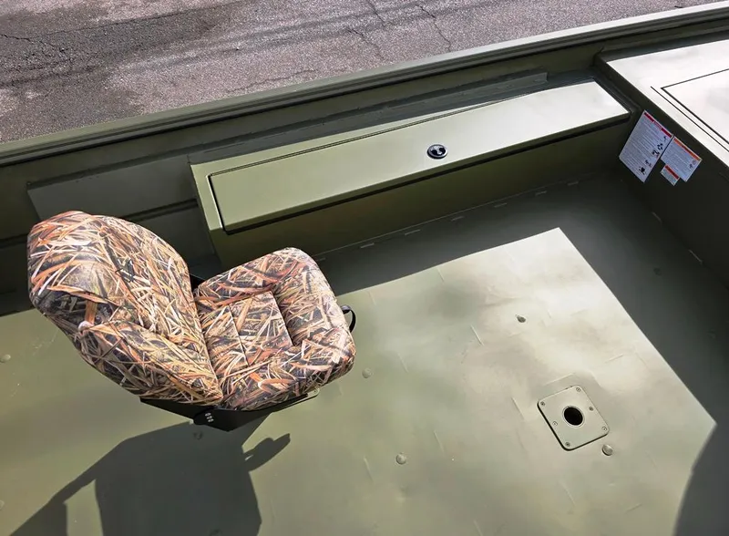 Slide: The Image of 2025 Lowe Roughneck RX2070 Tiller Steer boat interior with camo seat and storage compartment. - 10