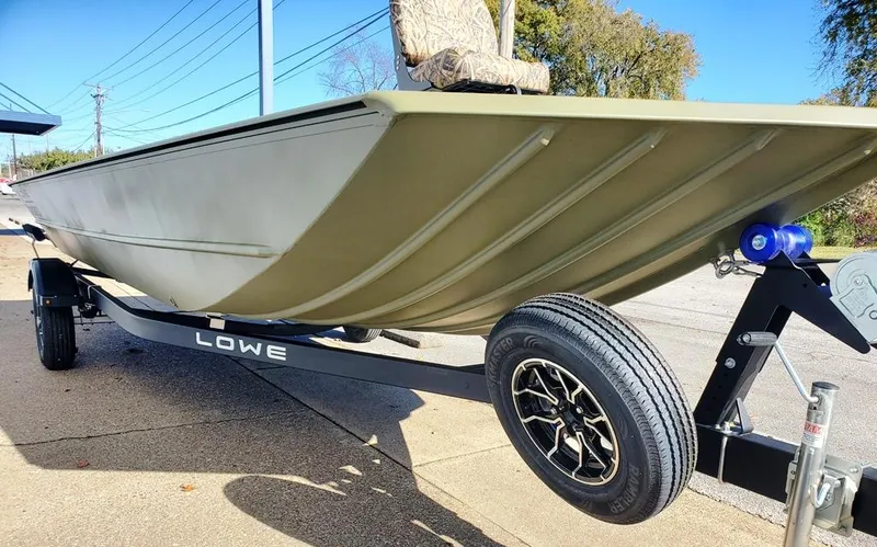 Slide: The Image of Spare Tire & mount, aluminum mag wheels, Heavy Duty all welded aluminum modified vee hull with reinforced keel. - 13