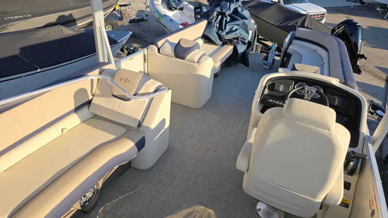 Slide: The Image of 2023 Avalon Catalina Cruise Funship interior with plush seating and modern helm. - 10