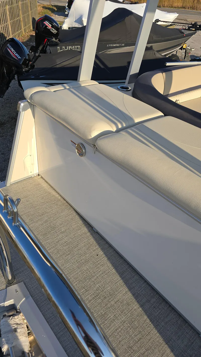 Slide: The Image of 2023 Avalon Catalina Cruise Funship boat, beige seating, sleek design, outdoor setting. - 14