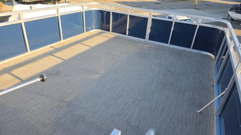 Slide: The Image of 2023 Avalon Catalina Cruise Funship 25' deck with blue panels and spacious layout. - 3