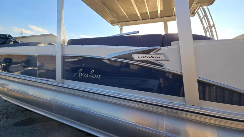 Slide: The Image of 2023 Avalon Catalina Cruise Funship pontoon boat with sleek design and modern features. - 5