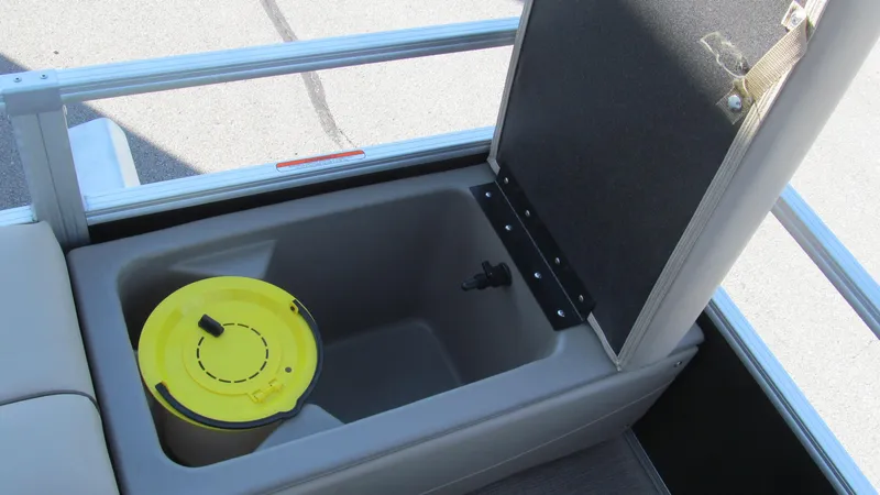 Slide: The Image of 2023 Sun Tracker SportFish 22 XP3 storage compartment with yellow bucket. - 14