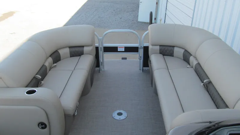 Slide: The Image of 2023 Sun Tracker SportFish 22 XP3 interior with beige seating and spacious layout. - 9