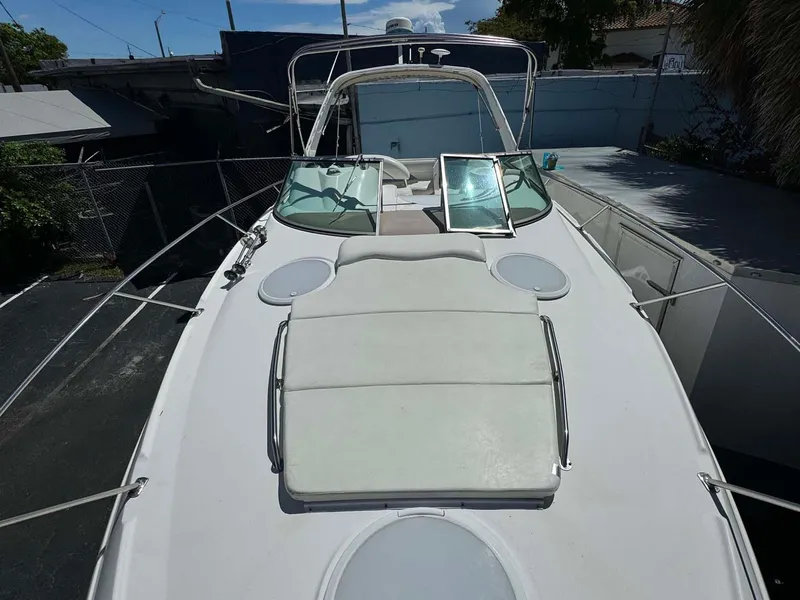 Slide: The Image of 2002 Larson 310 Cabrio boat with spacious deck and seating area. - 18