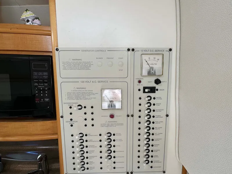 Slide: The Image of Electrical control panel on a 2002 Larson 310 Cabrio boat. - 25