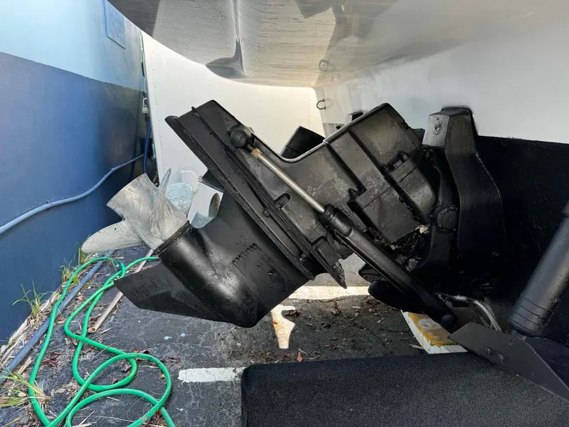 Slide: The Image of Close-up of 2002 Larson 310 CABRIO boat engine and propeller. - 4