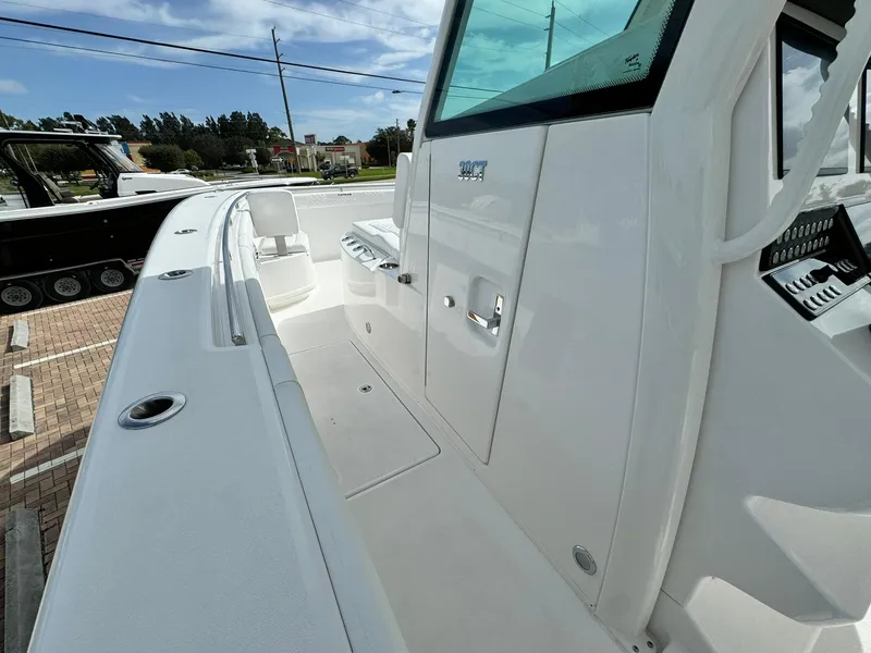 Slide: The Image of 2025 Caymas 30 CT boat, sleek white deck, modern design, spacious layout. - 15