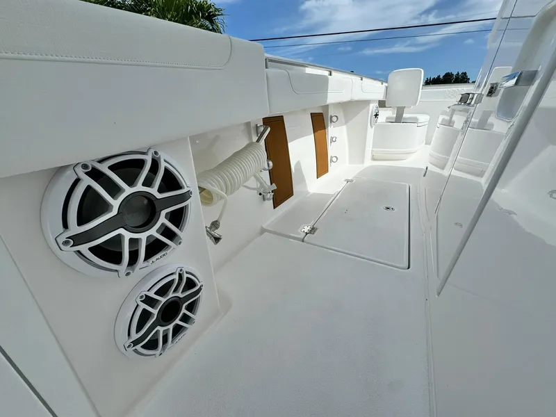 Slide: The Image of 2025 Caymas 30 CT boat interior with speakers and seating, showcasing modern design. - 18