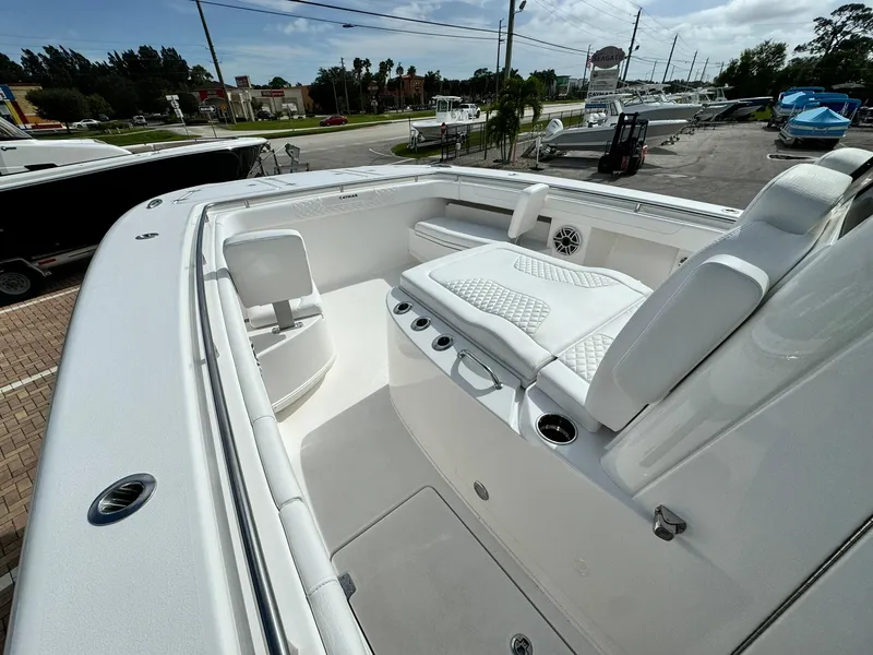 Slide: The Image of 2025 Caymas 30 CT boat interior with white seating and sleek design. - 19