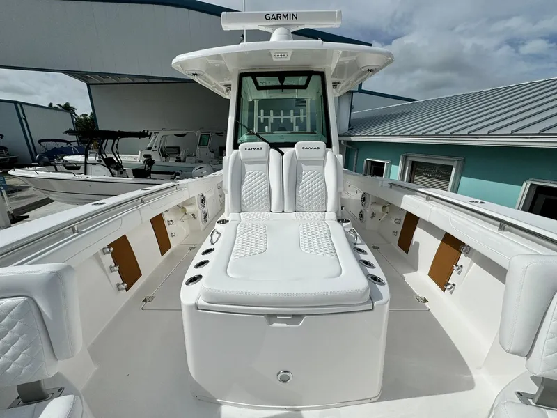 Slide: The Image of 2025 Caymas 30 CT boat with white seating and Garmin equipment. - 24