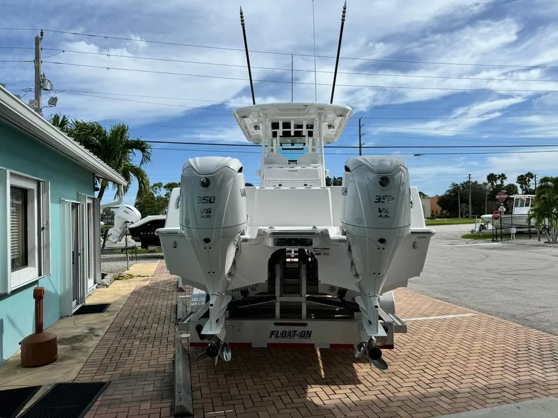 Slide: The Image of 2025 Caymas 30 CT boat with twin 350 engines on a trailer. - 3