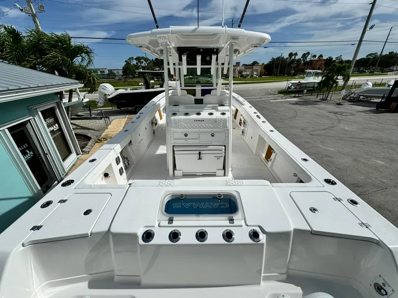 Slide: The Image of 2025 Caymas 30 CT boat, spacious deck, modern design, outdoor setting. - 5