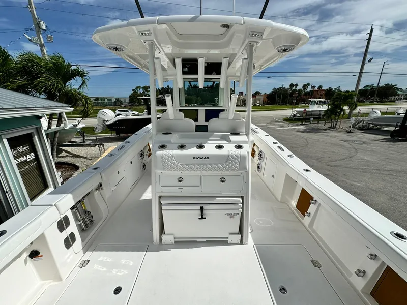 Slide: The Image of 2025 Caymas 30 CT boat interior with center console and seating. - 6
