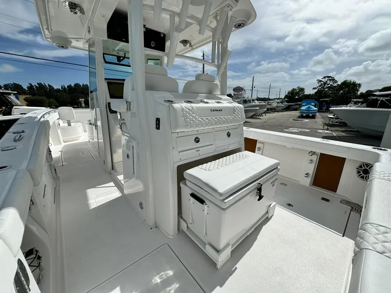 Slide: The Image of 2025 Caymas 30 CT boat interior, featuring sleek white design and modern amenities. - 7