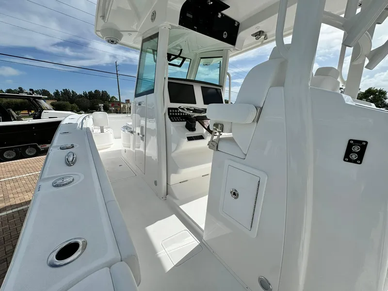 Slide: The Image of 2025 Caymas 30 CT boat interior with modern helm and seating. - 9