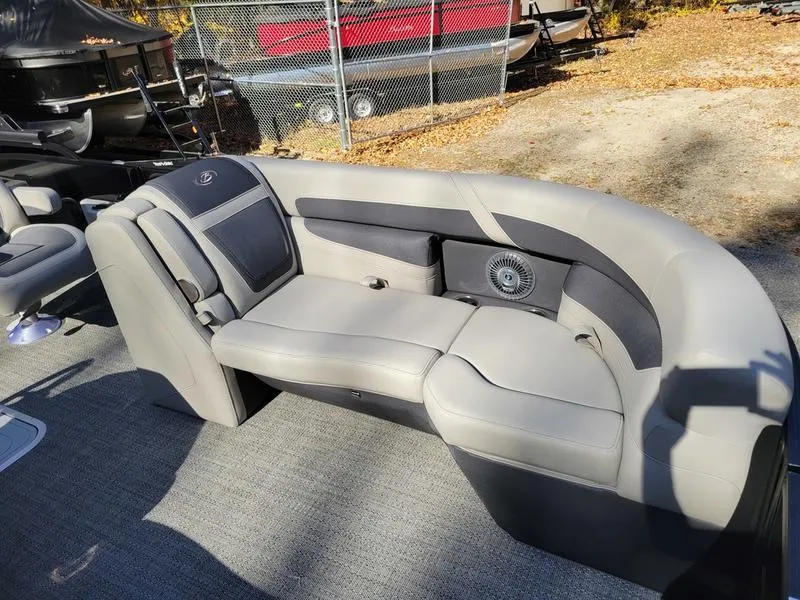 Slide: The Image of 2025 Barletta C22UC pontoon boat with gray seating and modern design. - 13