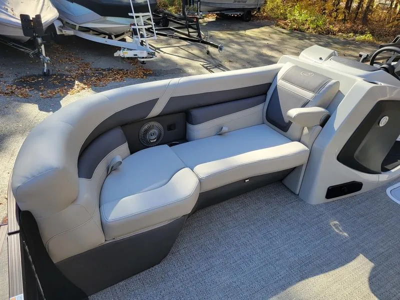 Slide: The Image of 2025 Barletta C22UC pontoon boat interior with gray seating and speaker. - 14