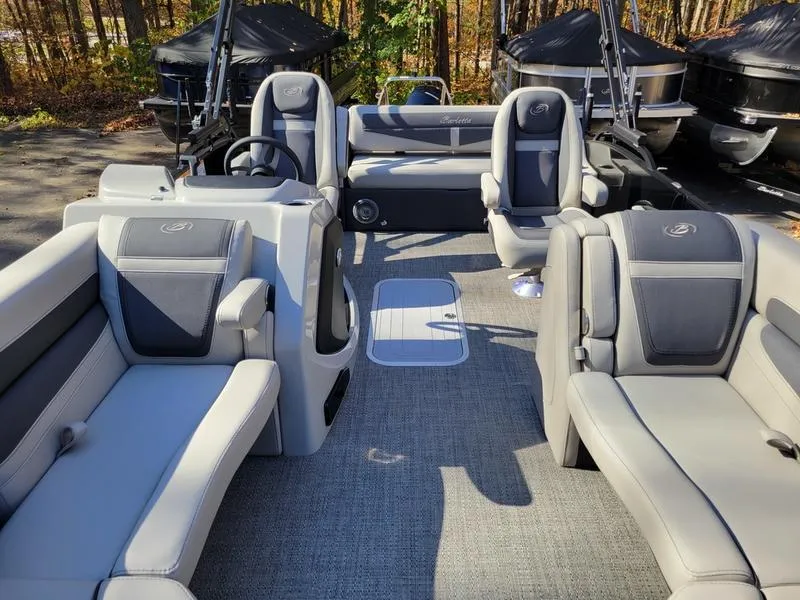 Slide: The Image of 2025 Barletta C22UC pontoon boat interior with gray seating and modern design. - 15