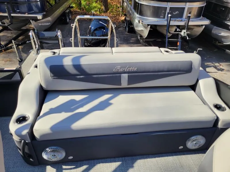 Slide: The Image of 2025 Barletta C22UC boat interior with gray seating and cup holders. - 20