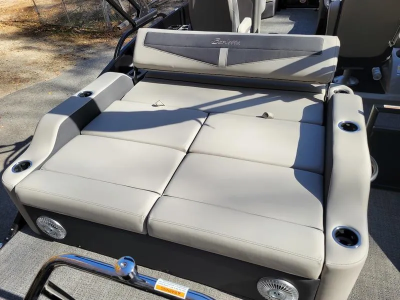 Slide: The Image of 2025 Barletta C22UC boat seating with cup holders and sleek design. - 21