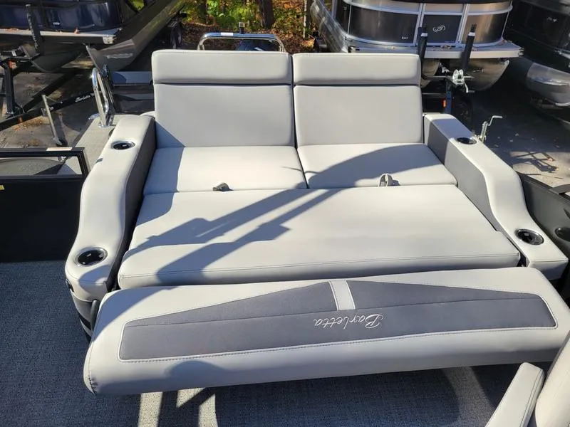 Slide: The Image of 2025 Barletta C22UC boat seating with gray upholstery and cup holders. - 24