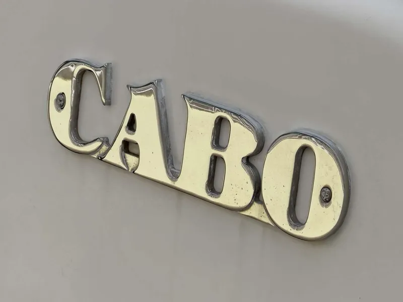 Slide: The Image of Close-up of 2007 Cabo 35 Express logo on a boat. - 12