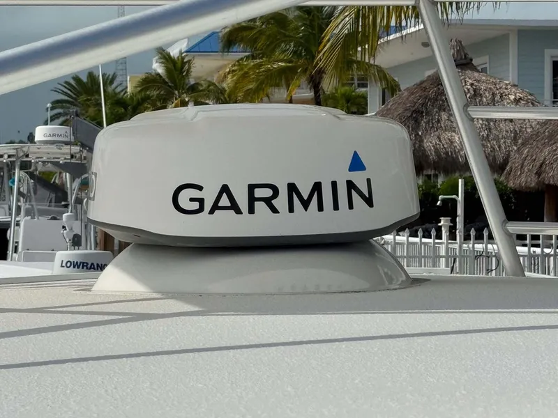 Slide: The Image of Garmin radar on 2007 Cabo 35 Express boat, docked with palm trees in background. - 28