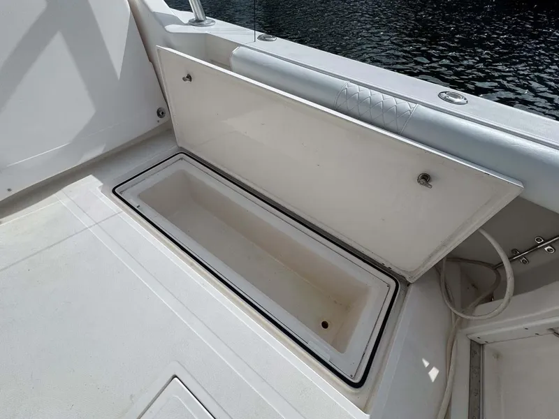 Slide: The Image of Open storage compartment on 2007 Cabo 35 Express boat deck. - 33