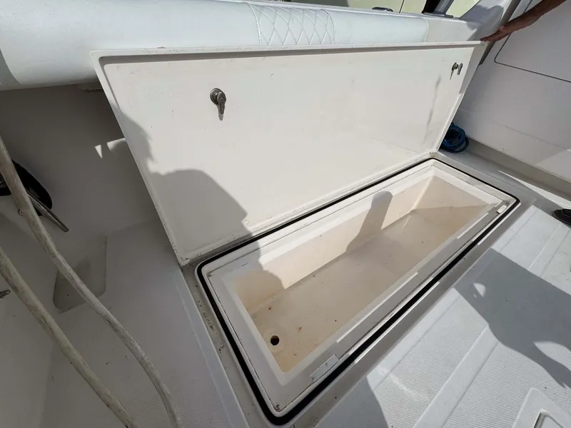 Slide: The Image of Open storage compartment on 2007 Cabo 35 Express boat deck. - 34