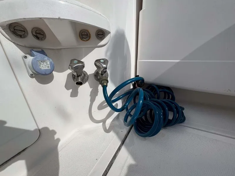 Slide: The Image of Coiled blue hose on 2007 Cabo 35 Express boat deck. - 35