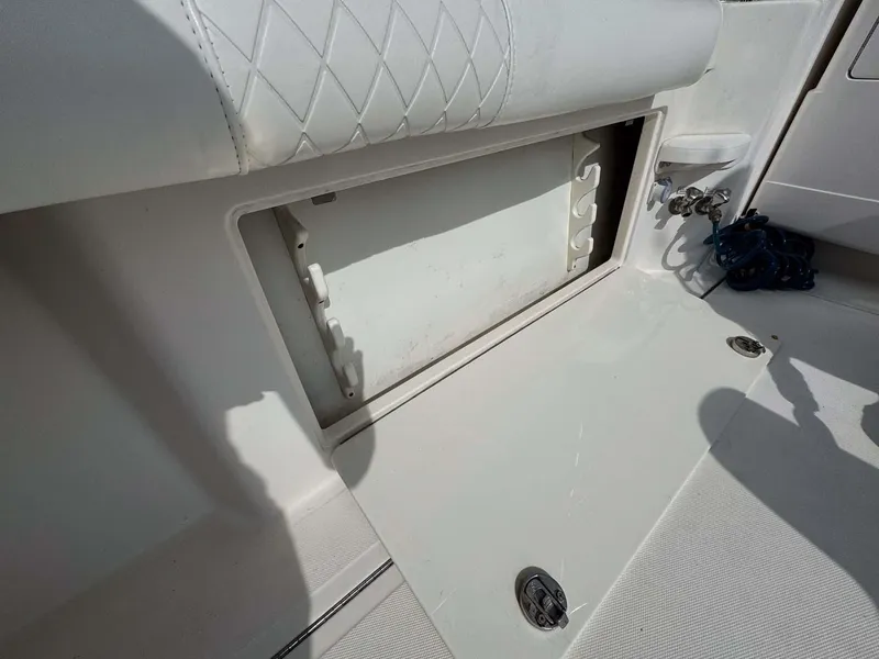 Slide: The Image of Open storage compartment on 2007 Cabo 35 Express boat deck. - 36