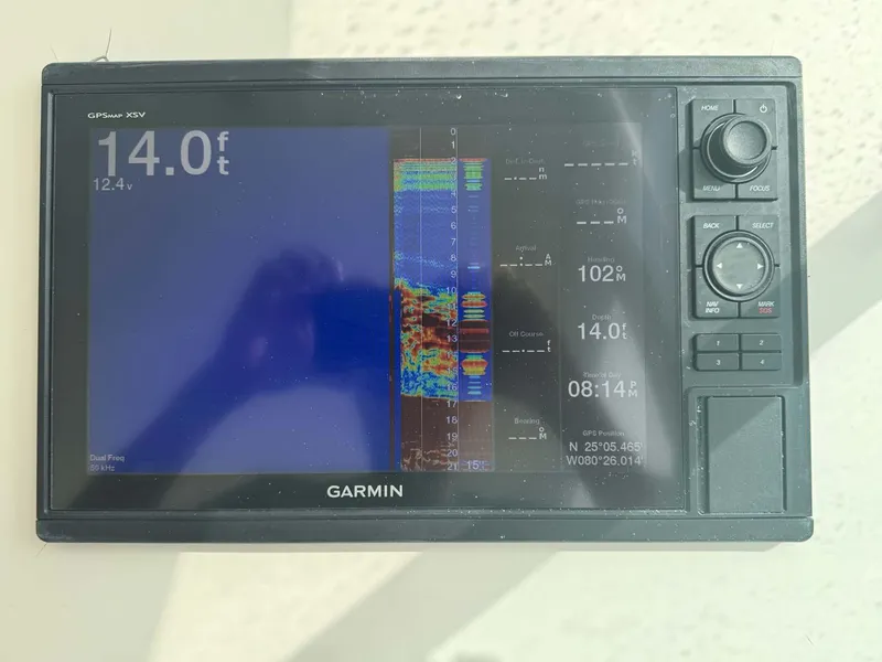 Slide: The Image of Garmin marine display showing depth and sonar data on a 2007 Cabo 35 Express. - 49