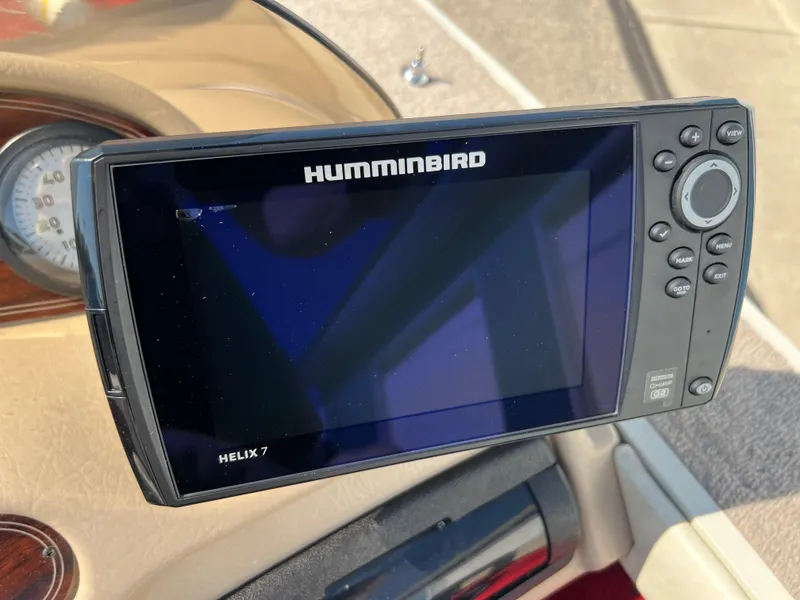 Slide: The Image of Humminbird Helix 7 fish finder on a 1997 Sylvan 1600 Pro Select boat dashboard. - 30