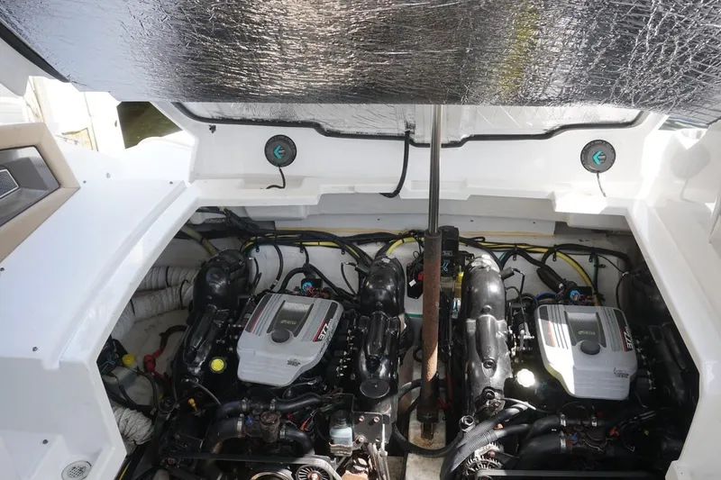 Slide: The Image of Engine compartment of 2015 Cruisers Yachts 328 BR with dual engines and wiring. - 12