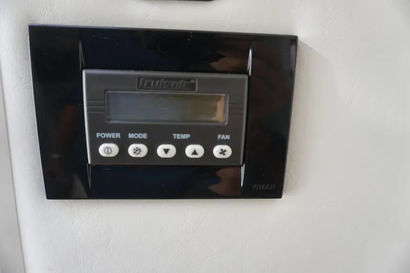 Slide: The Image of Control panel on 2015 Cruisers Yachts 328 BR, featuring power, mode, temperature, and fan settings. - 9
