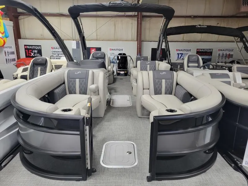 Slide: The Image of 2025 Barletta L23MA pontoon boat with luxurious seating and modern design in showroom. - 12