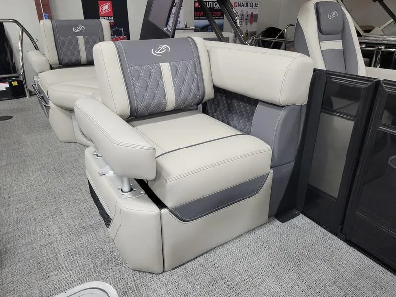 Slide: The Image of 2025 Barletta L23MA boat interior with luxurious gray seating and modern design. - 17