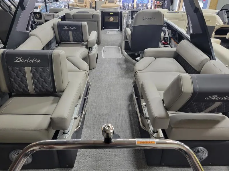 Slide: The Image of 2025 Barletta L23MA pontoon boat interior with luxurious seating and modern design. - 18