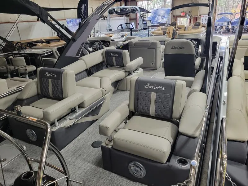 Slide: The Image of 2025 Barletta L23MA pontoon boat interior with luxurious seating and modern design. - 19