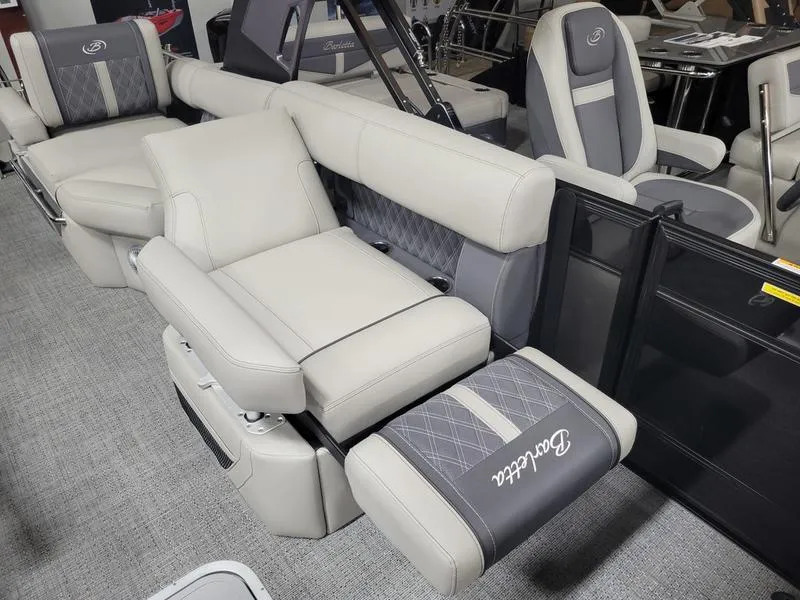 Slide: The Image of 2025 Barletta L23MA pontoon boat interior with luxurious seating and modern design. - 23