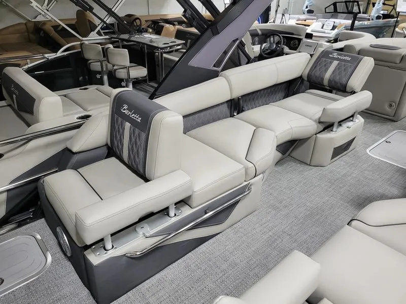 Slide: The Image of Luxurious interior of 2025 Barletta L23MA pontoon boat with plush seating and modern design. - 8