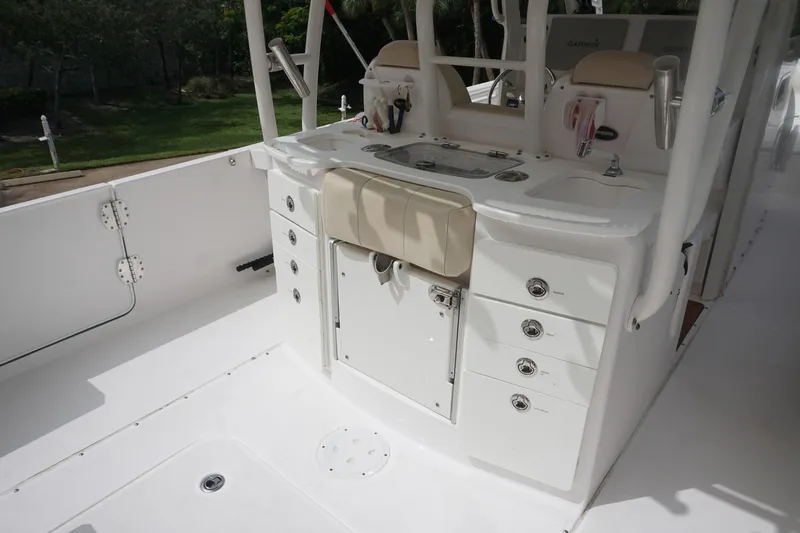 Slide: The Image of 2017 Everglades 355 CCX boat interior with storage and seating. - 19