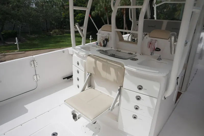 Slide: The Image of 2017 Everglades 355 CCX boat interior with seating and storage compartments. - 20