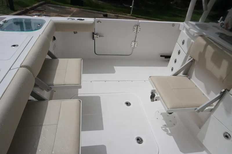 Slide: The Image of 2017 Everglades 355 CCX boat interior with seating and storage compartments. - 21